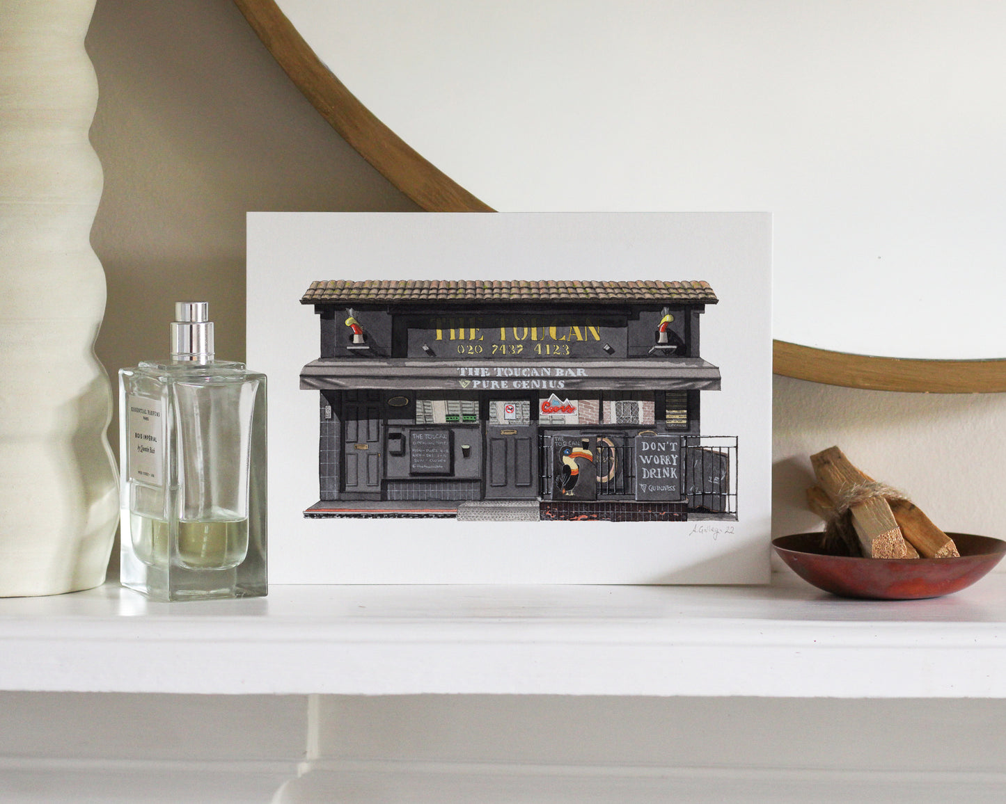 Decorative print of a bar with a bottle and bowl on a shelf