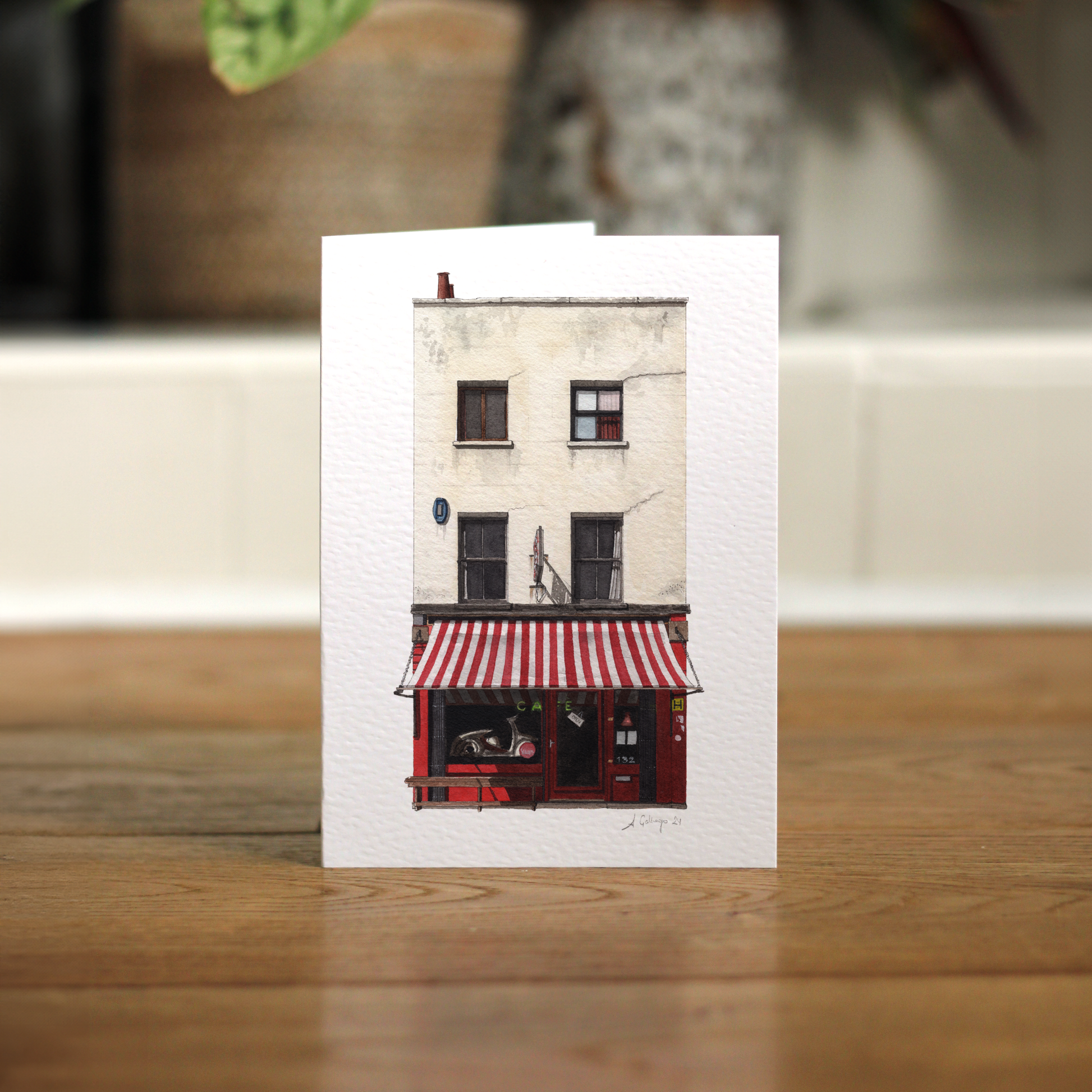 Scootercaffe in Lower Marsh. Greeting card placed in wooden floor